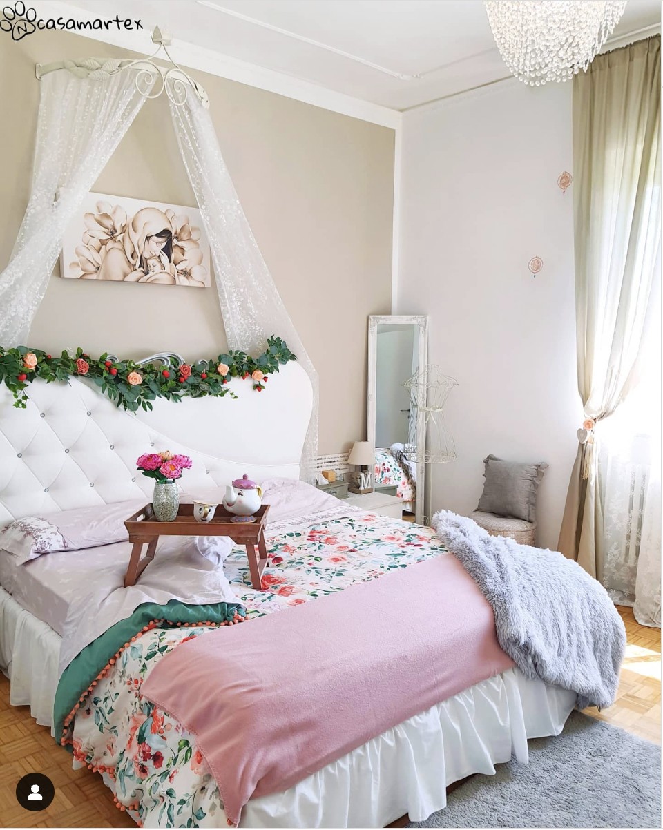 White Bed With Floral Blanket