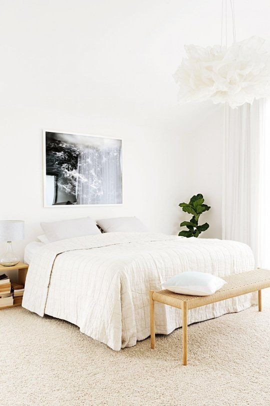 All-White Bedroom With Wooden Accents