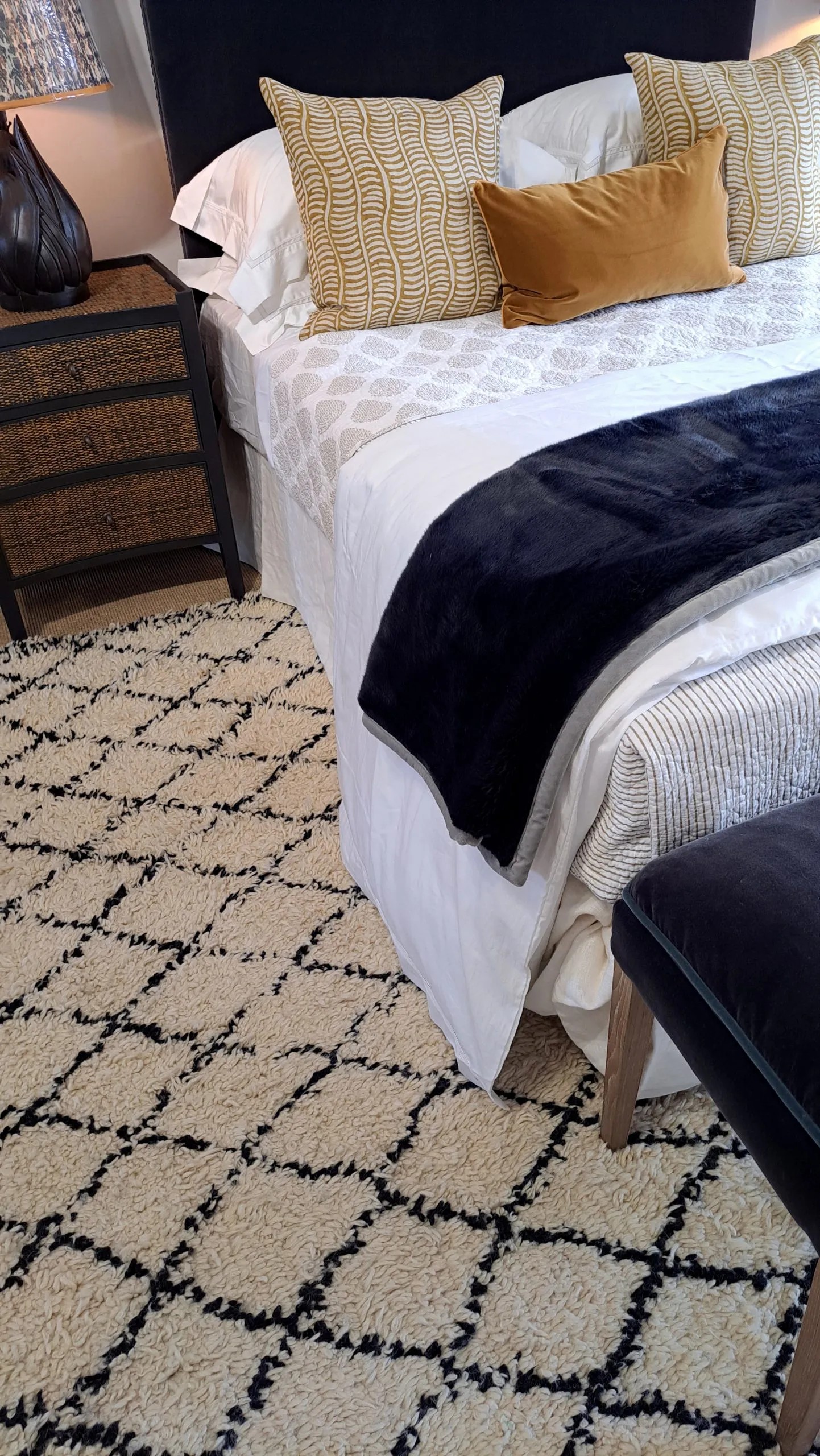 Add an area rug under your bedframe