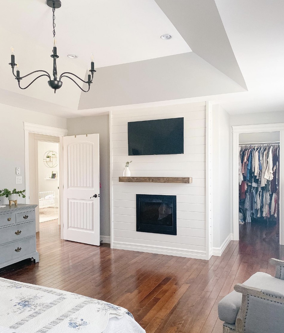 Shiplap Wall Fireplace With TV Above In Bedroom