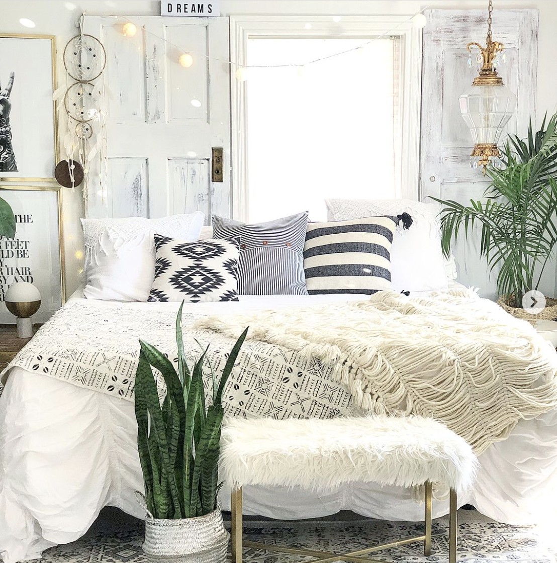 Mirror And Old White Distressed Doors For a Rustic Bedroom