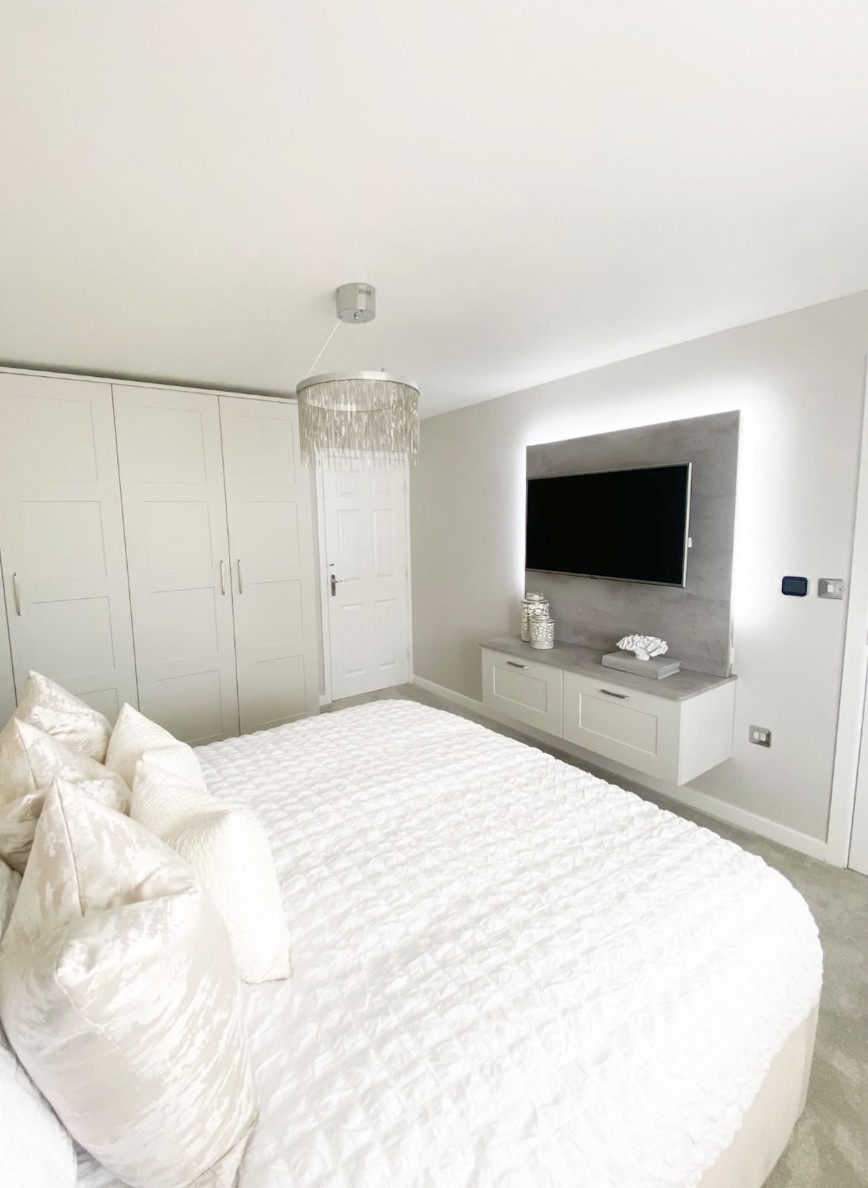 White Bedroom Interior Design With Wall-Mounted TV